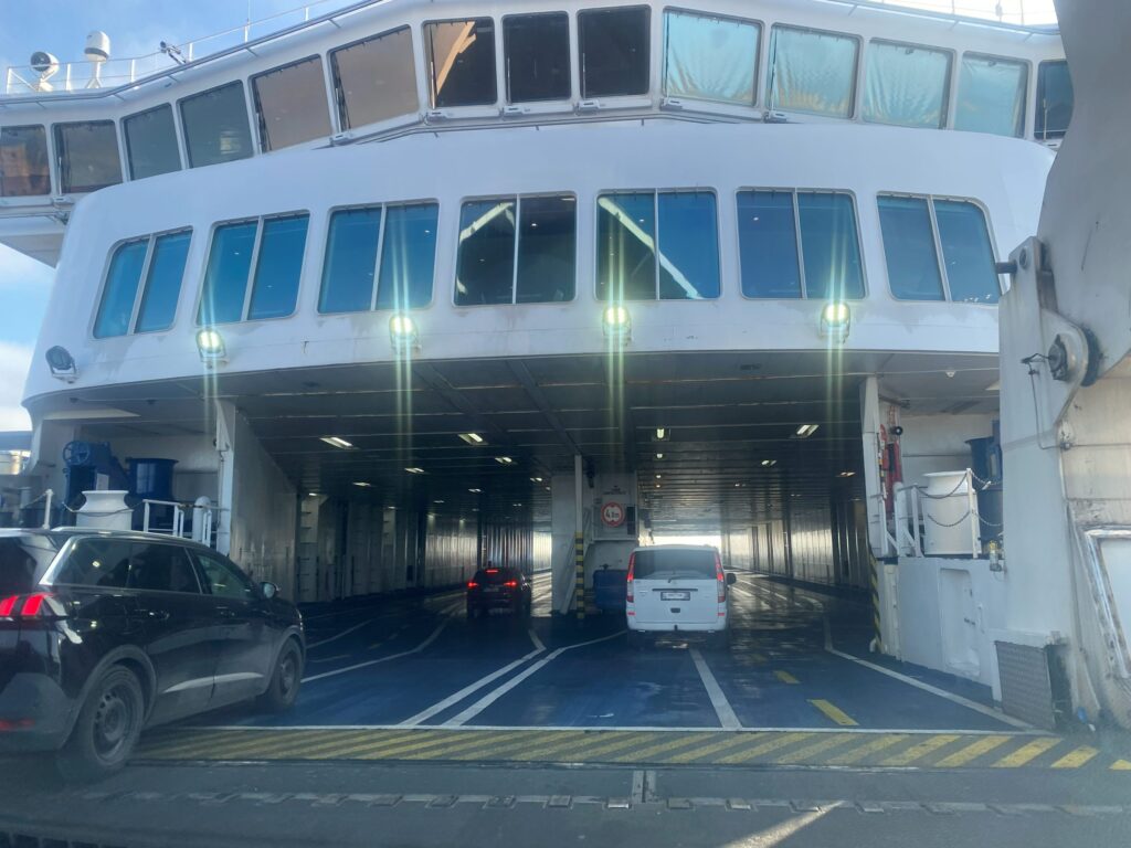 Cars driving through the bow onto the car deck of the Scandlines ferry