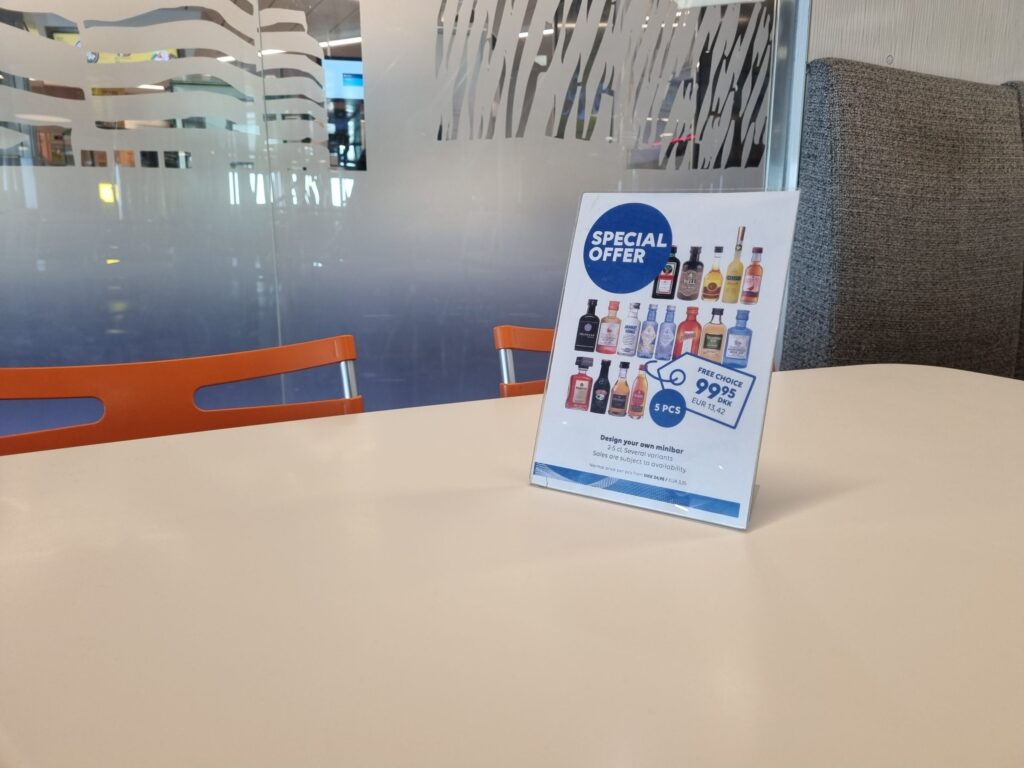 Offer card in the Travel Shop: five miniature bottles for 99.95 kroner